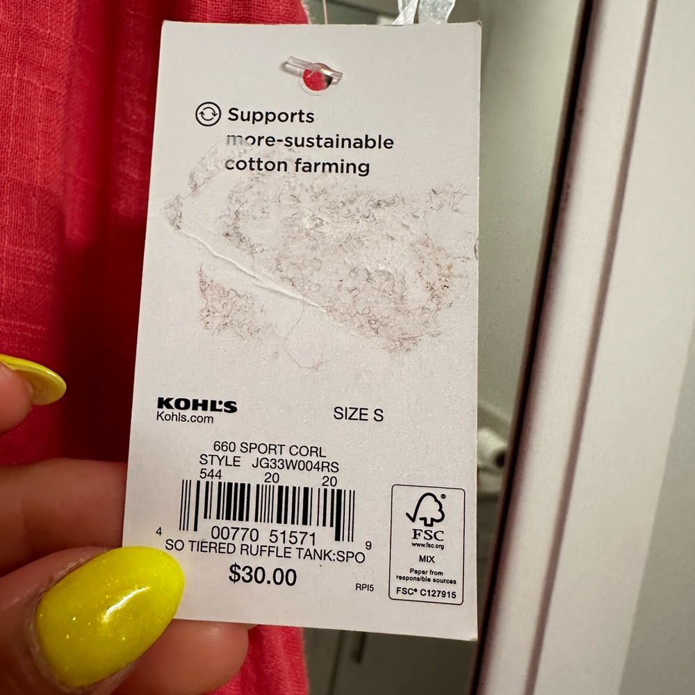 Cute coral color top. Great with a white pair of pants